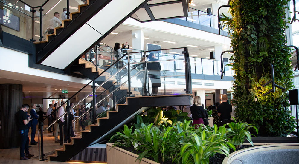 Staircase and green wall inside a modern office space